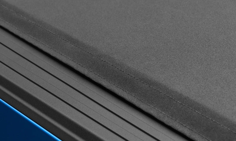 Lund 99-13 Ford F-250 Super Duty (6.8ft. Bed) Genesis Elite Roll Up Tonneau Cover - Black 96850