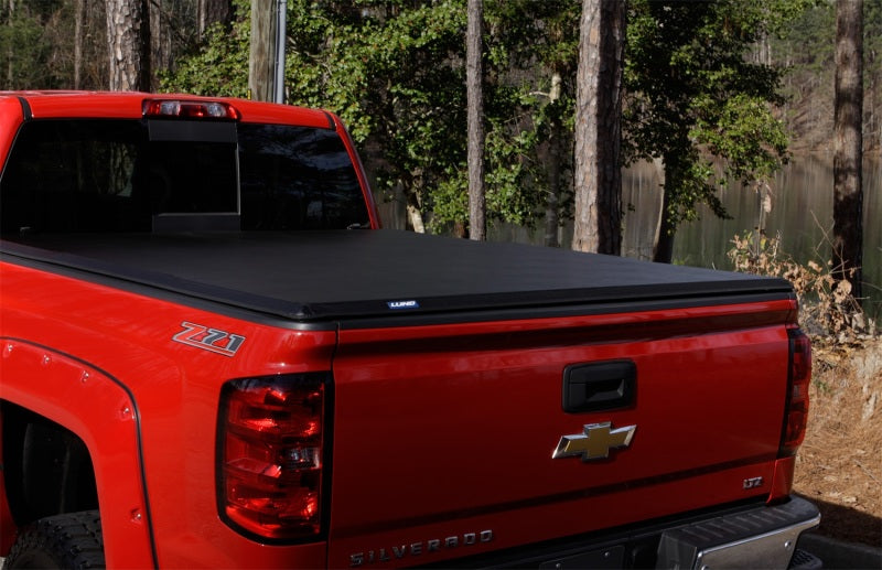 Lund 04-15 Nissan Titan (5.5ft. Bed) Hard Fold Tonneau Cover w/Bracket Kit - Black 969450